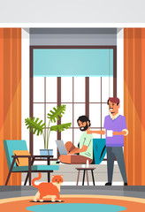 men couple using laptop drinking coffee spending time together during coronavirus quarantine self-isolation freelance stay home concept living room interior vertical full length vector illustration