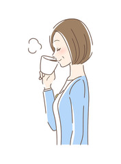 マグカップのコーヒーを飲む女性の横顔