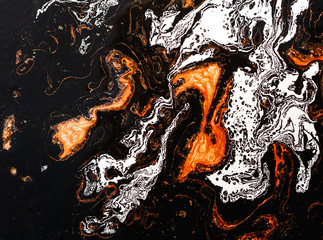 Golden swirl liquid, artistic design. Paper marbling is a method of aqueous surface design. Suminagashi – the ancient art of Japanese marbling.
