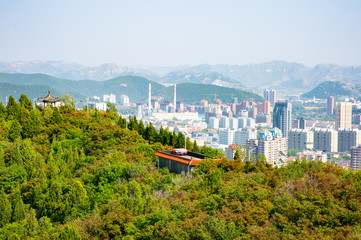 city view of Jinan from Mount Langmao. Jinan is surrounded by mountains. 