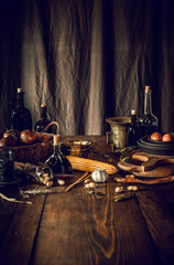 still life with food on a rustic wooden table