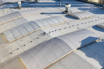 Large skylights on the roof of an industrial hall.