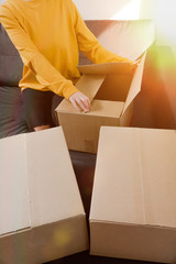Close up of a woman opens box. The customer received the package with fast delivery.