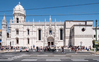 Obraz premium The south portal Manueline entrance to the Church of Santa Maria, part of the UNESCO heritage site Jeronimos Monastery. Lisbon, Portugal.