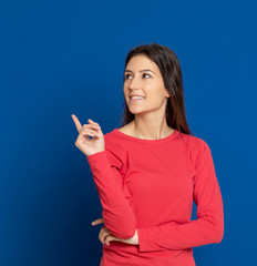 Fototapeta premium Brunette young woman wearing a red T-shirt