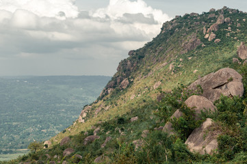 Slope of Kajulu mountains with boulders, view over Kisumu, Kenya