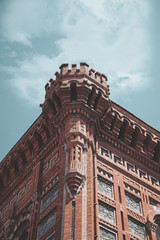 old brick building with blue sky