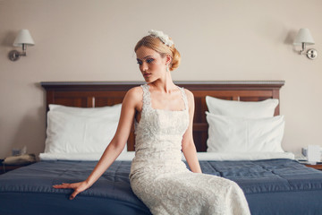 Model bride posing in a hotel