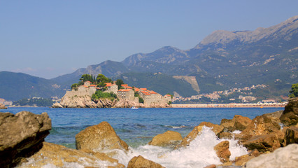 Fototapeta na wymiar Sveti Stefan island and waves of sea, Montenegro