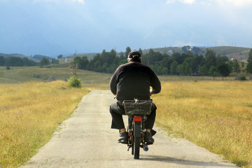 Old man on moped on Durmitor Ring road, Montenegro