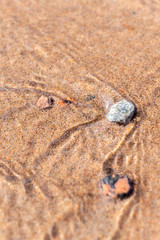 Small stones on the beach under sea water