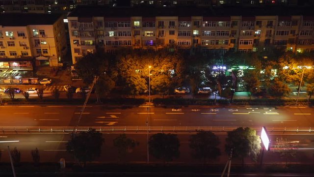 Busy road at night, in a residential district of Beijing (time lapse)