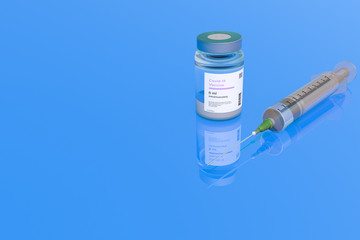 Covid 19 Vaccine glass bottle and syringe injection on a blue background.World pandemic concept. 3D Illustration. Copy space