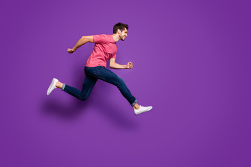 Fototapeta na wymiar Full length profile side photo of cheerful energetic guy jump run after season spring lucky discount wear good look outfit footwear isolated over bright color background