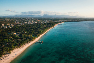Fototapeta na wymiar On the beautiful beach of the island of Mauritius along the coast. Shooting from a bird's eye view of the island of Mauritius.
