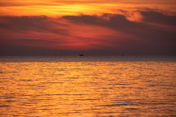 cloudscape golden sky on the sea in summer time