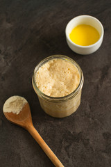 Sourdough starter, or levain: a living yeast rising and bubbling in a jar