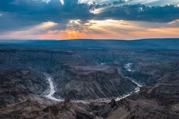 Dramatic Sunset over Fish River Canyon viewed from the main lookout near Hobas, Namibia, Africa. HDR Image