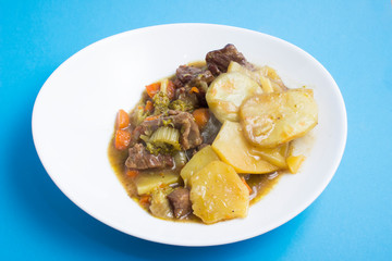 Lancashire hotpot.  is a stew originating from Lancashire in the North West of England. It consists of lamb or mutton and onion, topped with sliced potatoes and baked in a heavy pot on a low heat.