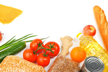 Food delivery, donation, food supply, copyspace. On a white background, buckwheat, pasta, sugar, peas, canned food, tomatoes, cucumber, bread, orange, apple, eggs, ginger, package.