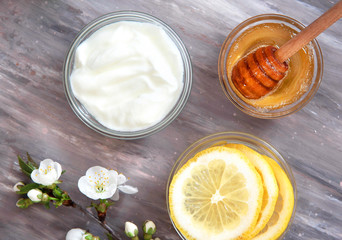 Obraz na płótnie Canvas Ingredients for homemade face mask honey, lemon, yogurt