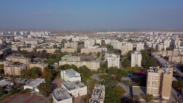 Flight above the buildings in residential district of Beer-Sheva city to forward direction