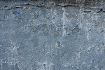 Close-up - gray stone wall in the old facade of the house