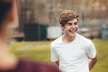 Boy smiling during physical training class in high school