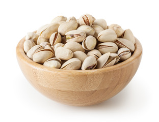 Salted pistachios in wooden bowl isolated on white background with clipping path