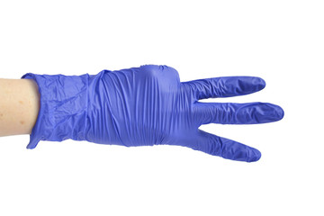 Hand in a medical glove shows three fingers.