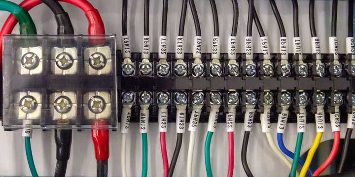 Terminal block. Industrial power case. Close-up of a power supply electrical wiring and Terminal block.