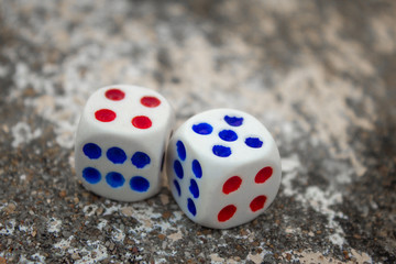 Close view of the dices used in play. Rolling out the dices.