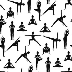 Seamless pattern with beautiful girls doing yoga poses black silhouettes. On white background.