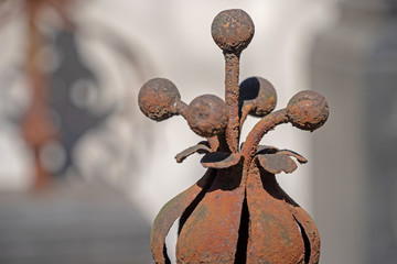 metallic red elements of the old fence