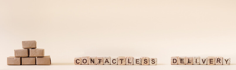 Cardboard boxes with groceries or other purchases. The inscription on wooden cubes 