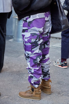 Woman with purple camouflage trousers and brown Nike shoes on January 16, 2017 in Milan, Italy