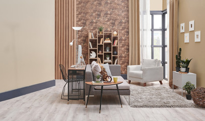 Brown living room interior decoration with wallpaper detail, grey sofa, wooden coffee table and working desk in the living room.