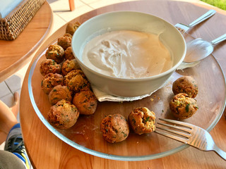 Fresh Mini Falafel Balls with Tahini Hummus Sauce Tahin / Small Roasted Chickpeas for Healthy Appetizer Snacks.