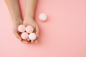 Spa concept. Bath bombs with woman hands
