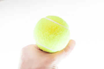 The tennis ball and the man's hand