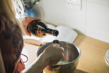Measuring brandy to make pastry