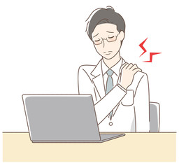 パソコンの前で肩が凝る男性