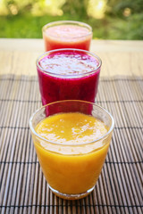 Dragon fruit, papaya and mango smoothies