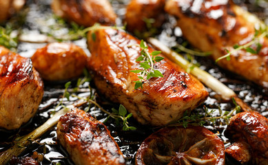 Grilled chicken breast with thyme and lemon, close up view