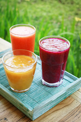 Dragon fruit, papaya and mango smoothies
