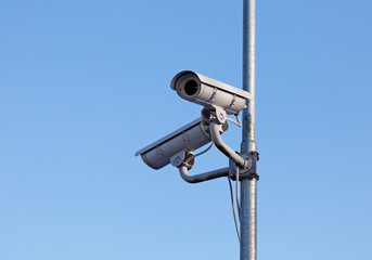 surveillance cameras mounted on a lamp post