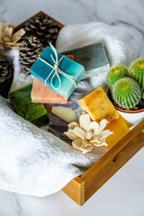 Spa box with organic handmade soap bars with white marble background.