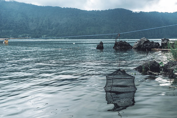 Obraz premium of old fish traps for fish standing in the water