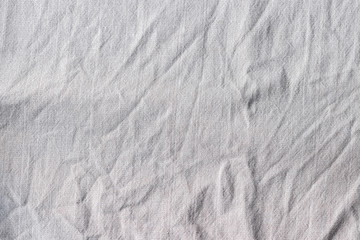 Natural linen fabric texture. Rough crumpled burlap background