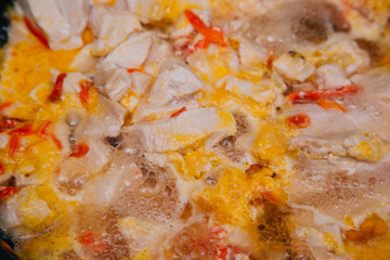 Meat with onions and carrots simmer in a pan. Cooking . Chicken Stew